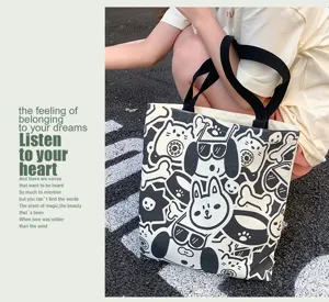 Canvas tote bag for women, large capacity shoulder bag, casual black and white daily handbag.