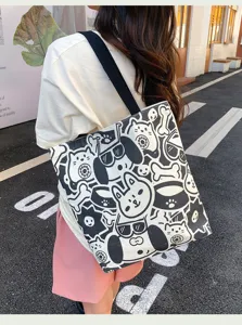 Casual black and white canvas tote bag with cute animal cartoon prints for daily use.