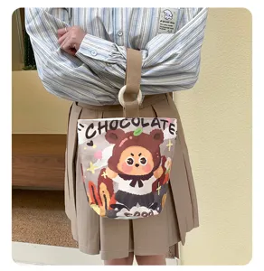 Chic canvas bucket bag with cute cartoon bear print, stylish handbag for daily casual outings.