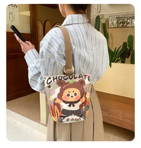 Casual canvas bucket bag with cute bear print, large capacity shoulder bag for daily use.