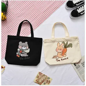 Canvas tote bag detail view, featuring cute bear and rabbit prints for daily casual use.