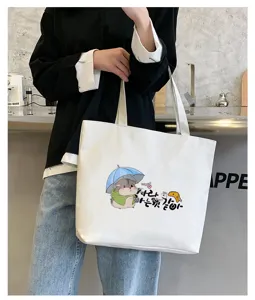 Canvas tote bag detail view, cute hamster cartoon print, stylish casual daily carry.