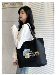 Large capacity black canvas tote bag for women, stylish shoulder bag with cute hamster print.