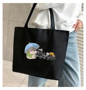 Casual black canvas tote bag for women with cute hamster print, large capacity daily shoulder bag.