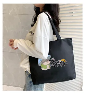 Large capacity canvas tote bag for women with cute hamster graphic, casual shoulder bag style.