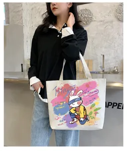Canvas tote bag with cute graffiti rabbit print, large capacity casual shoulder bag for daily use.