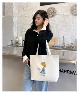 Detail view of a large white canvas tote bag featuring cute girl illustration for daily use.