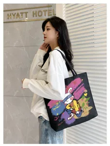 Canvas tote bag for women, large capacity student shoulder bag with stylish graffiti rabbit print.