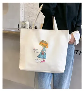 Detailed view of a canvas tote bag with a cute graphic print, large capacity and sturdy handles.