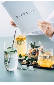 Nordic heat resistant glass cup detail showcase, transparent juice and fruit cold drink.
