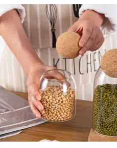 Glass sealed storage jar with cork ball lid, perfect for coffee beans, tea, and grains.