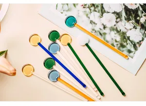 Detail view of colorful heat-resistant glass stirring sticks, perfect for coffee and desserts.