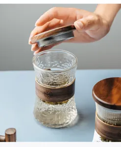 Japanese style hammered glass tea cup with wooden lid detail and infuser design for office.