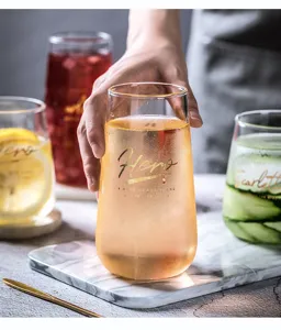 Klares Borosilikatglas Tasse mit Goldbuchstaben, ideal fuer Milch, Saft und Wasser Nutzung.