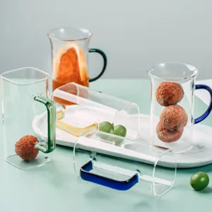 Square heat-resistant glass cup with colored handle for morning coffee, milk, and tea drinks.