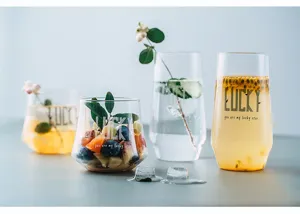 Detailed shot of Nordic heat-resistant glass cups featuring refreshing fruit and drink designs.