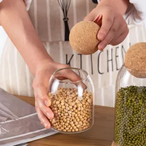 Glass sealed storage jar with cork ball lid for coffee beans, tea and food grain kitchen use.
