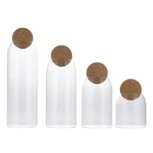 Set of 4 clear glass storage jars with round cork ball lids for kitchen food coffee bean tea.