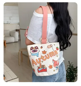 Casual canvas bucket bag with cute cartoon autumn print, pink strap, stylish handbag.