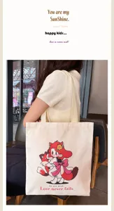 Canvas tote bag detail featuring a cute red-haired cartoon girl graphic print, casual daily use.