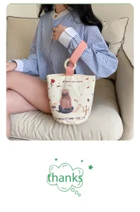 Canvas bucket handbag for women, casual daily tote bag with wooden ring handle and print.