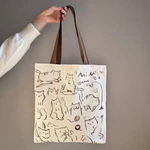 Canvas tote bag, cute cat print, casual shoulder bag for students and daily commuting.