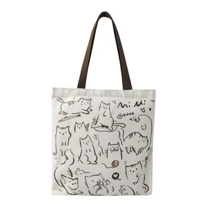 Cute hand-drawn cat canvas tote bag for women, large capacity student shoulder bag commuter.