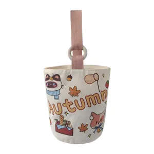 Cute canvas hanging storage bag with pink strap and autumn cartoon print for small items.