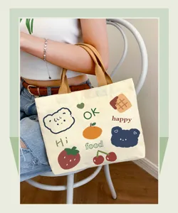 Cute Japanese canvas tote bag with cartoon fruit and bear prints for daily use or bento lunch.
