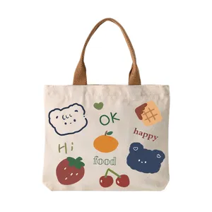 Cute cartoon canvas tote bag with lovely bear and fruit prints, perfect daily handbag.