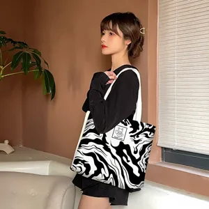 Large capacity black and white abstract wave canvas tote bag for daily casual commuting use.