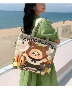 Cute bear print canvas tote bag for women, large capacity shoulder handbag with chocolate themes.