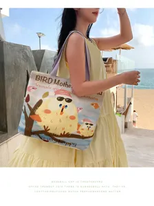 Canvas shoulder bag with original bird illustration, large capacity, casual beach style daily use.
