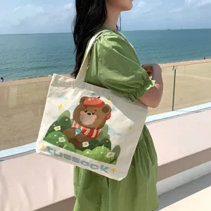 Casual canvas tote bag for women, large capacity shoulder bag with cute bear illustration design.