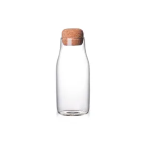 Clear glass storage bottle with cork stopper, perfect for juice, milk, and cold water beverages.