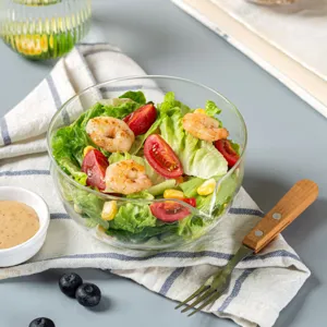 Clear glass pouring bowl for kitchen prep, dessert serving, and baking, durable and multi-use.