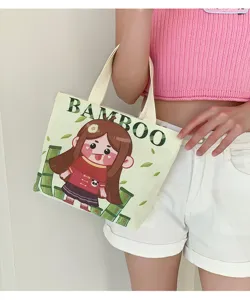 Cute cartoon girl canvas tote bag detail view, casual mini lunch handbag for daily use.