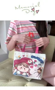 Mini borsa a mano in tela per donna con stampa di cartoni animati dolci e manici rosa eleganti.