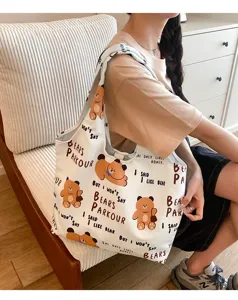 Casual cute cartoon canvas tote bag for women, large capacity shoulder bag for daily use.