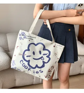 Casual canvas tote bag with cute cartoon cloud print and letter design for daily commuting.