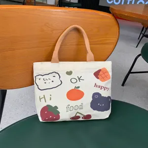 Cute cartoon print canvas handbag for women, casual tote bag with top handle and zipper.