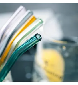 Close-up detail view of colorful bent glass straws in transparent tones for drinks and juices.