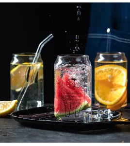 Transparent glass cola cup detailed view showing creative design with cute animal print and fruit.