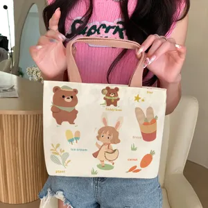 Cute canvas tote bag for women, casual student handbag, large capacity commuter shoulder bag.