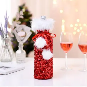 Christmas red sequin wine bottle cover with white faux fur trim for holiday dinner table decor.