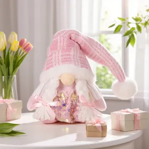 Poupée gnome de Noël en peluche rose avec chapeau à sequins scintillant, jolie déco de table.