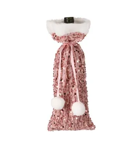 Pink sequin Christmas wine bottle cover with white plush trim and pom pom drawstring decor.
