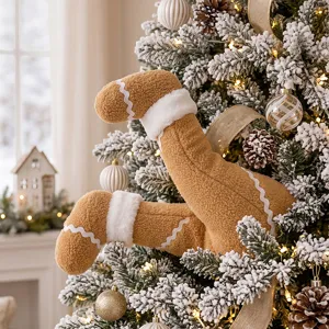 Plush gingerbread man legs Christmas tree hanging ornament holiday party detail shot