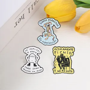 Cute Spanish quote enamel brooch set with quirky abstract animal and person illustrations.