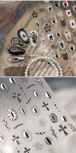 Macro detail of dark gothic Halloween nail stickers with silver spider and cross patterns